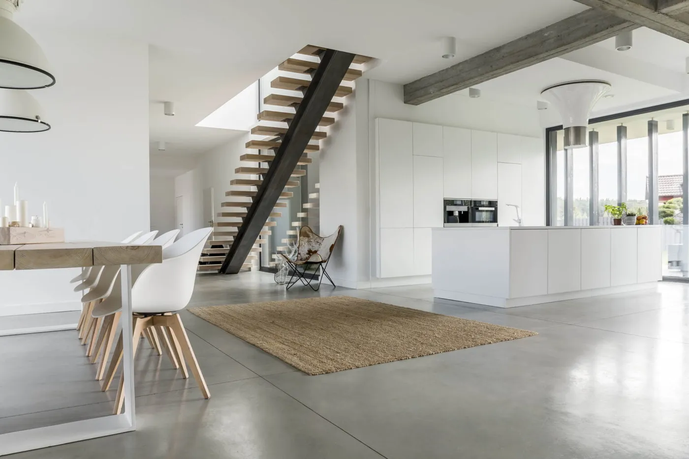 Open-plan living with floating staircase — Nicon Built